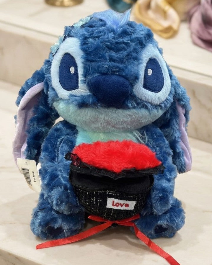 Stitch furry plush holding a heart